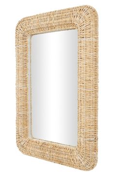 a mirror made out of wicker on a white background