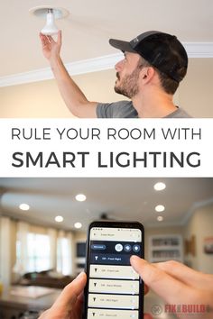 a man holding a smart phone in his hand and pointing to the ceiling light that is on