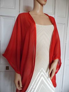 This is a beautiful hand made chiffon kimono ideal as a cover-up for weddings or special occasions. It has a satin edging. It can be made in any size from 8 to 24 (UK sizes). It is made in the UK. It is normally sent out to you within 5 days, but I am very happy to make your order a priority if you need it urgently. Just let me know the date needed by. Postage is free in the UK! International postage is £9. I am happy to exchange items or refund your payment if you are less than happy with the p Wedding Silk Wrap Kimono, Elegant Red Wrap Kimono, Silk Robe With Kimono Sleeves For Party, Silk Kimono Robe For Party, Silk Party Robe With Kimono Sleeves, Elegant Open Front Summer Shrug, Elegant Summer Wedding Kimono, Silk Evening Kimono With Kimono Sleeves, Silk Open Front Kimono For Evening