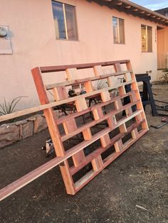 a wooden fence sitting in front of a house