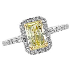 Crafted from Platinum the magnificent engagement ring comes enriched with 1.36 carats Cut-Cornered Rectangular Fancy Yellow Diamond Clarity SI1 GIA #6187262843 with Yellow Gold Settings and 50 Pave Diamonds 0.41 carats Split Shank. Size 6. Perfect High Jewelry Gift for Mom, Girlfriend, Daughter, Birthday or Christmas Gift. Yellow Diamond Ring With Emerald Cut, Yellow Emerald-cut Diamond Ring, Gia Certified Radiant Cut Diamond Ring, Yellow Diamond Cut Platinum Ring, Yellow Platinum Diamond Ring With Diamond Cut, Gia Certified Square Cut Moissanite Diamond Ring, Gia Certified Emerald-cut Platinum Cluster Ring, Gia Certified Yellow Gold Emerald Cut Halo Ring, Gia Certified Emerald Cut Yellow Gold Halo Ring