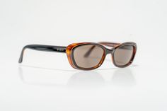 Vintage Gucci sunglasses in overall perfect condition. No scratches on frame or lenses. Sleek acetate frame in black, with clear shades of amber topped with a golden Gucci logo on the temples. Condition: Very good Delivered in original Gucci case Sales terms: Returns or exchanges cannot be accommodated for incorrect sizing. Please make sure if you have any doubts about sizing or measurements to contact me for more information. Thank you for your understanding. Gucci Logo, Un Logo, Gucci Sunglasses, Eyewear Sunglasses, Vintage Gucci, Sunglasses Accessories, Netherlands, Lenses, Bathing Beauties