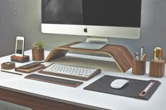 a desktop computer sitting on top of a desk next to a keyboard and mouse pad