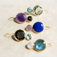 Elevate your everyday look with our Color Block Drops Earrings, inspired by the joyful art of mixing vibrant colors. Crafted with genuine semi-precious gemstones, these earrings are a playful yet sophisticated addition to your jewelry collection. Their unique design features a harmonious blend of hues, making them versatile enough to complement any outfit, whether you're dressing up for a night out or adding a pop of color to your casual attire. Lightweight and comfortable, the Color Block Drops Modern Multi-stone Yellow Gold Earrings, Modern Yellow Gold Multi-stone Earrings, Fusion Yellow Gold Earrings With Gemstone Accents, Fusion Style Yellow Gold Earrings With Gemstone Accents, Yellow Gold Fusion Earrings With Gemstone Accents, Luxury Earrings With Natural Stones, Luxury Round Earrings With Natural Stones, Modern Purple Gemstone Earrings, Amethyst Multi-stone Earrings As Gift