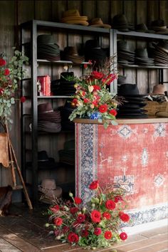 a room filled with lots of hats and flowers