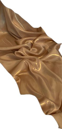 an image of a gold cloth that is very soft and drapy with some folds on it