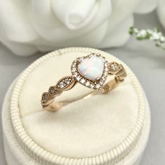 This beautiful ring is made from genuine 925 sterling silver with rose gold plating. Ring details- -The Main stone is a heart shape 6mm High Quality Lab Created White Fire Opal Stone -Side stones are round 1.5mm and 1.1mm simulated diamonds -Ring is casted in solid 925 sterling silver with rose gold plating (yellow gold and rhodium plated also available, please check the drop down menu for more options) -The Total face height of the ring measures 8mms and the band width measures 2mms -Each ring Rose Gold Birthstone Heart Ring For Promise, Rose Gold Birthstone Heart Promise Ring, Dainty Rose Gold Heart Cut Ring, Valentine's Day Rose Gold Heart Ring, Fine Jewelry Rose Gold Heart Ring With Birthstone, Fine Jewelry Heart Ring In Rose Gold With Birthstone, Elegant Heart-shaped Opal Ring For Anniversary, Rose Gold Heart Cut Diamond Ring, Rose Gold Heart Cut Ring For Gift