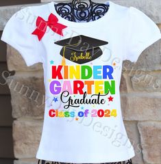 A bright, colorful Kindergarten Graduation shirt, personalized with your child's name and the year.  If you prefer Class of 3036 for high school, just request that on the order form.  If you are looking for a Preschool version, just request that on the order form as well. All shirts are 100% cotton.  I use a professional heat press to transfer the image, NOT a home iron.  The puffy sleeve tee comes in sizes 12 month - size 12 . I also carry the same brand shirt in a tank top style as well as lon Customizable T-shirt For Back To School Events, Personalized T-shirt For School Events At Year End, Personalized T-shirt For End Of School Year, Customizable T-shirt For School Events And Back To School, Customizable T-shirt For School Events, Letter Print T-shirt For Graduation, End Of School Year White T-shirt With Team Name, Multicolor School Spirit T-shirt For School Events, White Shirt With Name Print For School Events