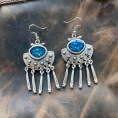 Elevate your style with our Ethnic Silver Dangle Drop Earrings with Blue Enamel, handmade from silver-plated Zamac. Perfect for everyday Boho flair and a thoughtful gift for your girlfriend. Discover comfort in Bohemian design. The unique dangle drop style adds a touch of individuality, making them a versatile choice for any occasion. The silver-plated Zamac not only ensures durability but also brings a subtle gleam to enhance your overall look. Zamac, composed of zinc, aluminum, magnesium, and copper, ensures both strength and a lightweight feel. The silver plating adds a touch of refinement, creating a captivating interplay of light and shadow. We prioritize comfort in our design, allowing you to enjoy these earrings effortlessly throughout the day. The lightweight nature of the material Blue Pierced Earrings For Festival, Blue Metal Earrings For Festivals, Nickel-free Blue Earrings For Festival, Bohemian Blue Metal Chandelier Earrings, Blue Bohemian Dangle Earrings, Blue Metal Bohemian Chandelier Earrings, Bohemian Blue Metal Earrings, Blue Bohemian Metal Earrings, Bohemian Oxidized Silver Chandelier Earrings