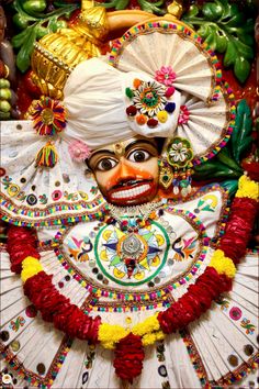 an elaborately decorated mask is displayed on display