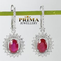 "Classic dangle ruby and diamond earrings made of solid 18k white gold. the rubies are natural, untreated of a premium quality. These beautiful gems featuring halo diamonds to add extra shine and sparkle.  * Packed in an elegant jewelry box. * Get a free worldwide shipping. * Appraisal certificate is included for the authenticity of diamond and gold. * We offer flexible payment plans Can't find what you are looking for? Custom made orders never been so easy. In a few simple steps we can design for you the jewelry of your dreams, send me a message and get a quote. Follow us on Facebook  https://www.facebook.com/spsprimejewelry METAL: Solid 18k white gold RUBY: Natural ruby SHAPE: Oval shaped QUANTITY: 2 rubies CT WEIGHT: 2.39 ct weight total ORIGIN: Natural, not treated, not enhanced DIAMON Ruby And Diamond Earrings, 18k Gold Earrings, Packing Jewelry, Classic Earrings, Ruby Earrings, Diamonds And Gold, Conflict Free Diamonds, Elegant Jewelry, Buying Jewelry