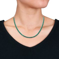 Simple and elegant, this slender lab-created emerald tennis necklace adds a sophisticated and eye-catching pop of color to your look. Crafted in sterling silver, this accessory features a glistening row of 54 heart-shaped lab-created emeralds and one round lab-created emerald at center, all boasting a rich and alluring shade of green. This 18-inch chain includes a 2-inch extender for an adjustable fit. | Heart-Shaped Lab-Created Emerald Tennis Necklace | Sterling Silver | White | Size 18" | Helz Elegant Green Tennis Necklace As A Gift, Elegant Green Tennis Necklace For Gift, Elegant Green Tennis Necklace Gift, Green Necklace With Prong Setting, Pave Necklace, Helzberg Diamonds, Lab Created Emerald, Target Clothes, Emerald Necklace