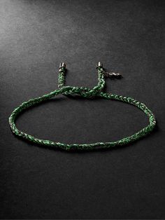 Carolina Bucci says she likes to constantly play with her jewellery, which explains why her designs, including this 'Lucky' bracelet, are tactile. Inspired by braided cotton friendship styles, it's hand-woven from 'Apple Green' silk, tipped with blackened gold and has a dollar-sign charm. Luxury Adjustable Braided Jewelry, Green Woven Bracelet Jewelry, Green Braided Bracelet Jewelry, Luxury Braided Adjustable Bracelets, Adjustable Green Woven Jewelry, Luxury Adjustable Braided Jubilee Bracelets, Luxury Adjustable Braided Jubilee Bracelet, Luxury Green Adjustable Bracelet, Green Braided Bracelet