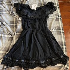 Black. Size 8. New With Tags. Still Wrapped In Its Plastic. Black Mini Dress With Lace Trim, Black Lace Trim Dresses For Spring, Black Mini Dress With Lace Trim For Spring, Chic Black Mini Dress With Lace Trim, Black Ruffled Mini Dress For Vacation, Black Casual Dress With Lace Trim, Casual Black Dress With Lace Trim, Casual Black Mini Dress With Lace Trim, Black Lace Trim Dress For Date Night