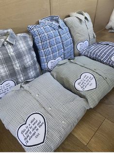 several pillows with hearts on them sitting on the floor