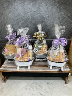 three baskets filled with food sitting on top of a wooden shelf next to each other