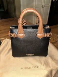 Gently used  ( only a couple times) BURBERRY a:LL Baby Banner purse 4055839 smoke free home  stored in dust bag Baby Banners, Burberry Black, Couple Time, Burberry Bag, Black Tan, Black And Tan, A Couple, Bags Handbags, Burberry