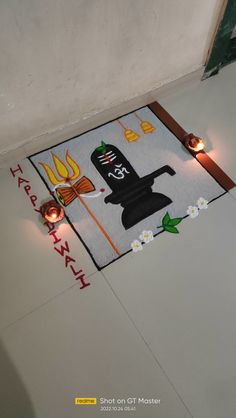 a door mat with candles on the floor