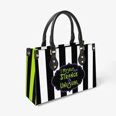 Unleash your inner goth with this stylish handbag, inspired by the iconic aesthetic of Beetlejuice. Bold, eye-catching, and full of personality, this black and white striped tote perfectly captures a love for the peculiar and the extraordinary. With a vibrant pop of neon and a hint of mystery, this bag embodies the essence of quirky individuality and dark whimsy. Crafted from premium PU (vegan) leather, this handbag offers durability, comfort, and style, making it a statement piece for any alternative fashion wardrobe. Make a bold statement with this "Strange and Unusual" bag that blends practical function with gothic charm. Product Features:  ✅ Eco-friendly PU Leather surface, durable for long-time use. PU leather is considered vegan-friendly because it doesn't contain animal extracts or Iconic Aesthetic, Strange And Unusual, A Dark Room, Vegan Leather Handbag, Soft Bristle Brush, My Whole Life, Dark Room, Bold Black, Beetlejuice