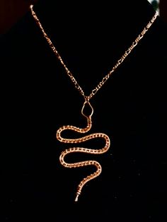 This is an adorable copper snake pendant, wire wrapped by hand and with love.  Please choose what kind of cord or chain you would like.   These would make a great gift for your friendly neighborhood witch friend or anyone who appreciates the beautiful creepy crawlies that we share a planet with. Note:  Each item is made to order, and there may be slight differences from the original photo. Handmade Snake-shaped Necklace For Gift, Handmade Snake Necklace For Gifts, Handmade Snake Shape Necklace Gift, Handmade Snake Shape Necklace For Gift, Wire Wrapped Snake, Wrapping Stones, Wire Wrapped Stone Jewelry, Wire Tutorials, Snake Pendant