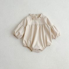 Product ID: BB51539  Material: 98% Cotton  Color: Beige      Bodysuit Size Chart        Size (Age)    Height (CM)   Chest (CM)    Length (CM)       3-6M     60-66     50    40      6-12M     67-75     53    43      12-18M     76-85     56    46      18-24M     86-95     59    49             Dress Size Chart        Size (Age)    Height (CM)   Chest (CM)    Length (CM)       18-24M     86-95     60    53      2-3T     95-105     64    57      3-5T     105-115     68    61      5-7T     115-125     72    65      7-9T     125-135     76    69      *Babies grow at their own pace. It's recommended to choose the size that corresponds to your mini's height and weight rather than their age for a much more accurate fit. Please also take delivery time into consideration.  *The parcel only contains th Long Sleeve Bubble Romper For Summer Playwear, Summer Long Sleeve Bubble Romper For Playwear, Fitted Solid Color Jumpsuits And Rompers With Puff Sleeves, Casual Beige Cotton Bodysuit, Long Sleeve Bodysuit For Playtime In Fall, Long Sleeve Bubble Romper For Spring Playwear, Cotton Long Sleeve Jumpsuits And Rompers For Playwear, Cute White Jumpsuits And Rompers For Fall, Casual Long Sleeve Bubble Romper For Spring