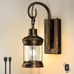 an old fashioned light fixture hanging from a wall