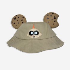 Jack Jack Bucket Hat Get ready for Pixar Fest with our Jack Jack bucket hat! With felt cookie ears. The hat has a drop brim to provide the perfect amount of shade for when you're waiting to ride the Incredicoaster or getting some cookies 💛 Item Details 🤓 - Cotton fabric  - Handsewn Felt Ears ✨ - Child OS Approx. 19 1/2" - 20 1/2" - Adult S/M Approx. 22 1/2"- 23 1/2" - Adult L/XL Approx. 23 1/2" - 24" - Hat brim is 2.5" for adult size  Due to these being hand made to order we do not accept returns.  If you find there's a problem with your item send us a message and we will be more than happy to assist you. Cookie Bucket, Pixar Fest, Jack Jack, Num Num, Jack And Jack, Bucket Hats, Caps Hats, Hand Sewing, Bucket Hat