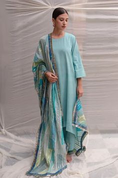 Teal dupatta with sequin, patchwork, bead, zardozi, gota embroidery and tassel fringe border.
Component: 1
Pattern: Embroidery
Type Of Work: Sequin, bead, zardozi, gota
Fabric: Silk, Brocade, Satin, Cotton, Chikankari , Tissue
Color: Blue,Green
Other Details: 
Fringe border
Note: Kurta and pant worn by the model is not for sale
Occasion: Puja - Aza Fashions Gota Embroidery, Embroidered Dupatta, Pattern Embroidery, Silk Brocade, Silk Embroidery, Fabric Silk, Tassel Fringe, Blue Silk, Aza Fashion