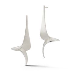 This large contemporary earring in sterling silver is a bold expression of style. En Pointe Earrings sculpturally twist much like a dancer, into an energetic shape with beautifully high polished edges creating a dramatic look with sleek lines. Shown in Mist Finish. Available in Oxidized Sterling Silver, 18K White Gold or 18K Yellow Gold. Sterling Silver Mist Finish 2.25” long Silver Modernist Earrings For Formal Occasions, Modern Silver Pear-shaped Earrings, Modern Oblong Sterling Silver Earrings, Modernist Silver Drop Earrings, Modernist Sterling Silver Pierced Earrings, Silver Mist, Contemporary Earrings, Dramatic Look, Oxidized Sterling Silver