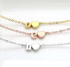 Silver rose gold,gold plated initial and heart bracelet. Letters are lowercase measuring 6mm in size with 7mm heart. Bracelet measures 7 inches with and comes with 1,5 inch extension. CARE: Plated jewelry is a great way to accessorize at affordable prices but must be maintained for longer lasting. . Avoid contact with water, pools, perfumes, chemicals and keep in a cool dry place or air tight container or jewelry box. Do not sleep or shower with your jewelry. Please view all photos for details. Gold Bracelets For Bridesmaid Gift On Valentine's Day, Gold Bracelets For Bridesmaids, Valentine's Day Gift, Gold Bracelets For Bridesmaid Gift, Initials Name Bracelet For Anniversary On Valentine's Day, Initials Name Bracelet For Valentine's Anniversary, Valentine's Day Initials Name Bracelet For Anniversary, Dainty Bracelets For Bridesmaid Gift On Valentine's Day, Dainty Bracelets For Bridesmaids, Valentine's Day Gift, Gold Bracelets With Initials For Valentine's Day