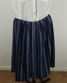 Navy striped Skirt size 24, elasticated waist 38in, length 26 in below knee length with back kick pleat, machien wash 40 deg C, easy care, drip dry Casual Striped Pleated Bottoms, Casual Striped Pleated Skirt, Casual Striped Midi Skirt, Casual Striped Lined Skirt, Casual Cotton Skirt With Vertical Stripes, Casual Striped Long Skirt, Casual Striped Flowy Skirt, Striped Lined Skirt For The Beach, Striped Lined Skirt For Beach