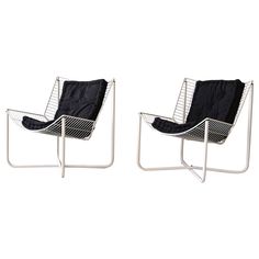 two black and white chairs sitting next to each other