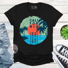 California retro style surf shirt. Vintage Palm trees and the beach. Perfect for wearing at the beach, fishing, surfing, boating or just living the dream. Surf Tee Design, Retro Surfing T-shirt For Beach Season, Relaxed Fit Palm Tree Print T-shirt, Surfing Crew Neck T-shirt With Sublimation Print, Casual Relaxed Fit Shirt For Surfing, Sublimation Print Crew Neck T-shirt For Surfing, Beach Season Graphic Print Relaxed Shirt, Crew Neck T-shirt With Sublimation Print For Surfing, Casual Pre-shrunk Surfing T-shirt