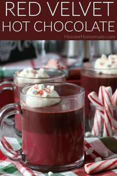 two mugs filled with hot chocolate and candy canes