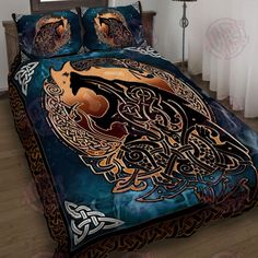 a bed covered in a blue and gold comforter