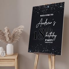 a welcome sign for an 18th birthday party with gold confetti and sparkles