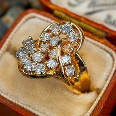 This elegant vintage cluster ring features 18 round brilliant cut diamonds and is crafted of 14k yellow gold. This ring is currently a size 6.5. Freeform Ring, Vintage Cluster Ring, Diamond Heart Ring, Diamond Cluster Ring, Gold Diamond Rings, Diamond Cluster, Vintage Diamond, Diamond Heart, Round Brilliant Cut Diamond