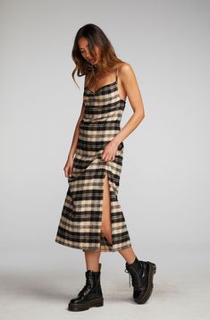 If you don't own Flannel in your winter wardrobe, have you ever gone shopping? Our Flannel Midi Slip Dress is equal parts seasonal and stylish, with a Side-Slit and some cleavage. Pair with black combat boots for an effortlessly edgy aesthetic. Black and beige are a combo of the season, so prepare for plenty of wear! Flannel Midi Slip Dress Fabric Content: 100% Cotton Model is 5'9" and wearing size small Imported Style: CW9354-LP Flannel Over Dress, Dress And Combat Boots Outfit, Combat Boots With Dress, Combat Boot Outfit, 90s Slip Dress, Grunge Boots, Punk Dress, Edgy Aesthetic, Flannel Dress