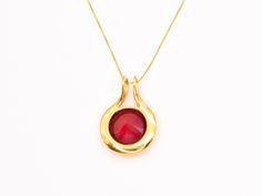 Gold Ruby Pendant set with a Created Ruby in a flawless diamond cut & bright red color, at 18mm (20 Carats).Gold Vermeil: 18k Gold over Solid 925 Sterling Silver ☞ made to last.Click here for ☞ Statement Jewelry CollectionMatching Ring & Earrings ☞ please ask meDetails:• Created Ruby in a flawless clarity• Ruby: 18mm, 20 Cts, diamond• Dimensions: Pendant Height 32mm, Width 22mm• Free Complimentary Chain• 18k Gold VermeilSKU 1246 Classic Red 14k Gold Necklace, Classic Red Jewelry With Round Cut, Luxury Red Round Cut Jewelry, Classic Red Round Cut Jewelry, Ruby Pendant With Diamond Cut, Ruby Necklace With Polished Yellow Gold Finish, Yellow Gold Ruby Necklace With Polished Finish, Formal Round Pendant Necklace With Shiny Finish, Formal Ruby Jewelry With Faceted Details