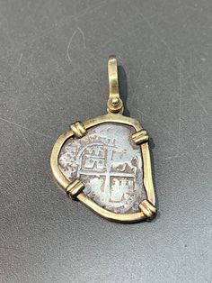 "How unusual is this antique coin! Bezeled around in 14K gold, measures 1.5 inches by 1.9 inches! Perfect to be worn alone! Measurements: 1.50 inches by 0.90 inches Metal: 14K Yellow Gold Markings: \"14K\" Weight: 6.1 grams" Metal Casting Jewelry, Gold Coin Jewelry, Jewelry Knowledge, Modernist Architects, Coin Art, 5 Elements, Antique Coins, Casting Jewelry, Cameo Necklace