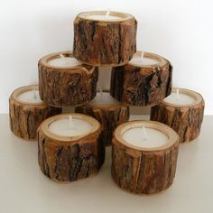 a stack of wooden candles sitting on top of each other