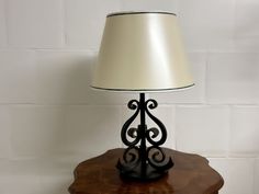 a lamp sitting on top of a wooden table