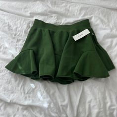 Urban Outfitters Skirt Size Large Condition: Nwt Color: Dark Green Details : - Comfy - Pull Up Style Urban Outfitters Skirt With Pockets, Cheap High Waist Skirt By Urban Outfitters, Cheap Green Relaxed Fit Skirt, Green Ruffled Mini Skort, Green Ruffled Skirted Skort, Green Stretch Tiered Mini Skirt, Green Ruffled Skort, Fitted Green Skort With Ruffles, Chic Green Ruffled Skirt