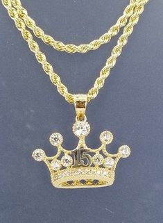 A beautiful crown for the princess that turns 15, all in 14k gold With a 20 inch and 2mm thick, rope style necklace in 14k gold for just $489.00! Pendant is 15mm in height and 20mm width, with zirconia synthetic stones. Gift box is included. Una hermosa corona para la princesa que cumpla sus 15 años en oro de 14k Con una cadena estilos torzal de 20 pulgadas y 2mm de gruesa, en oro de 14k por tan solo $489.00! El pendiente esta 15mm de alto y 20mm de ancho, con piedras zirconia seteticas . Caja d All In, Thick Rope, For The, Style Necklace, The Princess, Necklace Lengths, Cubic Zirconia, Gold Necklace, Gift Box