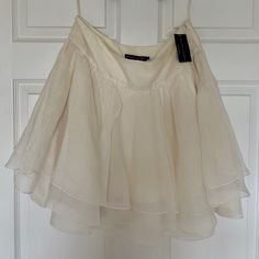 Flouncy And Beautiful Silk Skirt. Never Worn. Tags Still On. Three Layers Of Lined Silk. Ivory Color. Side Zip And Hook Closure. 20” Long. Dry Clean Only. Luxury Silk Mini Skirt For Spring, Ballet Core Wrap Skirt, Silk Lleated Skirt, Ivory Silk Mini Skirt, Ruffle Skirt Silk, Three Skirts, Fit Board, Ralph Lauren Skirts, Everyday Clothes