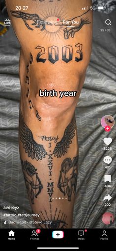 the back of a man with tattoos on his legs and chest, showing birth year