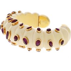 Celebrate the brilliance of artisanal excellence and innovative design with the David Webb 18K Yellow Gold Cabochon Cut Ruby And Fluted Bone Cuff Bracelet. This exquisite piece exudes timeless elegance and sophistication, capturing the essence of vintage glamour. Crafted from luxurious 18K yellow gold, the cuff features mesmerizing cabochon-cut rubies that add a pop of rich color and allure.The fluted bone accents enhance the bracelet's unique appeal, adding a touch of organic beauty to the design. With a width of 6.5 inches, this cuff bracelet is a statement accessory that commands attention and complements any outfit with effortless grace. The intricate detailing and impeccable craftsmanship make it a true masterpiece, perfect for the discerning woman who appreciates fine jewelry with a Luxury Cuff Bracelet With Oyster Detail, Luxury Yellow Gold Cuff Bracelet With Gemstone, Luxury Cabochon Bangle Jewelry, Formal White Jubilee Cuff Bracelet, Luxury Yellow Gold Cabochon Bracelets, Luxury Yellow Gold Cuff Bracelets, Luxury Yellow Gold Bracelets With Cabochon, Luxury Cuff Bangle For Formal Events, Luxury Cuff Bangle For Formal Occasions