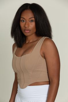 Our Brown Beige Corset Tank Top is so stunning and versatile. This corset-style tank has wide straps, a curved hem, and structured paneling on the bodice. Made for everyday, this tank is double lined for maximum support. Chic Crop Top With Built-in Bra And Wide Straps, Stretch Tank Top With Built-in Bra, Chic Sleeveless Tank Top With Boned Bodice, Fitted Vest Crop Top With Wide Straps, Fitted Crop Top Vest With Wide Straps, Fitted Crop Top With Wide Straps, Chic Fitted Vest With Built-in Bra, Fitted Sleeveless Tank Top With Corset Back, Sleeveless Crop Top With Boned Bodice For Night Out