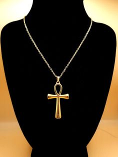 Discover the timeless elegance of our Ankh Pendant Necklace, a stunning piece of jewelry that transcends style boundaries. Expertly crafted with an 18k gold plating, this unisex necklace embodies the rich heritage of Ancient Egypt, featuring the iconic Ankh - the Key of Life. Made from hypoallergenic, tarnish-free 304 stainless steel, this necklace ensures comfort and longevity for even the most sensitive skin. The gold finish provides a luxurious touch, while its waterproof design guarantees du Key Of Life Necklace, Ankh Pendant, Key Of Life, Ankh Necklace, Egyptian Jewelry, Ancient Egypt, Egypt, 18k Gold, Pendant Necklace