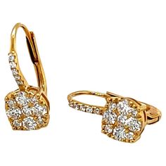 These beautiful diamond cluster earrings are perfect for everyday and special occasions! Sparkling white diamonds set in 18k yellow gold form elegant drops that sit just below the ear lobe, beneath a delicate line of petite diamonds. Comfortable 18k wire backs are secured with hinged lever backs. Earrings measure 5/8" in length and 1/4" in diameter. Simple yet sophisticated, you'll reach for these earrings when you want the perfect finishing touch to any outfit! 28 round brilliant-cut diamonds, Luxury Modern Earrings With Lever Back, Luxury Round Diamond Earrings With Lever Back, Modern Luxury Earrings With Lever Back, Luxury Dangle Earrings With Lever Back, Luxury Fine Jewelry With Lever Back, Luxury Lever Back Earrings For Women, Luxury Classic Yellow Gold Cluster Earrings, Luxury Elegant Diamond Earrings With Lever Back, Luxury Lever Back Anniversary Earrings